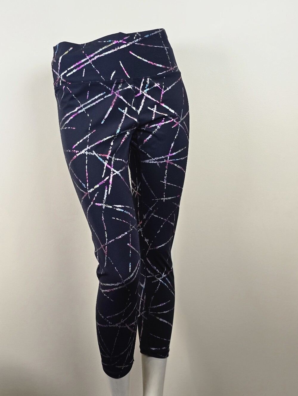 ZYIA Active Hi-Rise Cropped Leggings In Retro Glam Metallic Over A Black Base